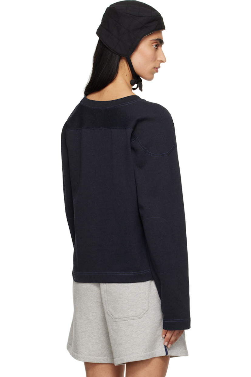 Heavyweight cotton- and lyocell-blend jersey sweatshirt.

· Rib-knit crewneck
· Logo embroidered at chest
· Felted text appliqués at front
· Graphic patch at hem
· Modified saddle shoulders
· Contrast stitching in blue

This item is part of a limited run of 90.

Supplier color: Navy