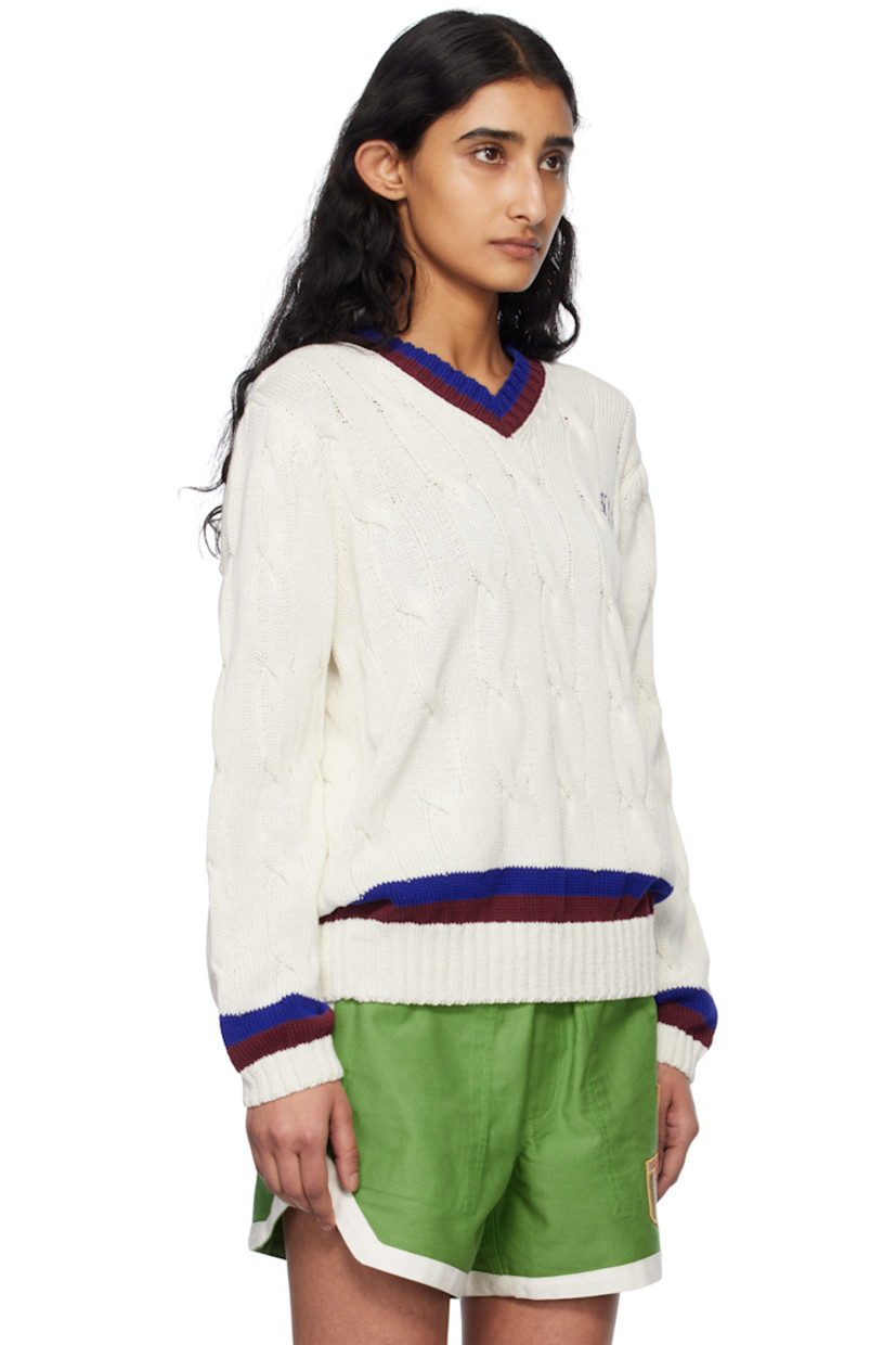 Cable-knit cotton sweater.

· Stripes at rib-knit V-neck, hem, and cuffs
· Logo embroidered at chest
· Dropped shoulders

This item is part of a limited run of 60.

Supplier color: Cream