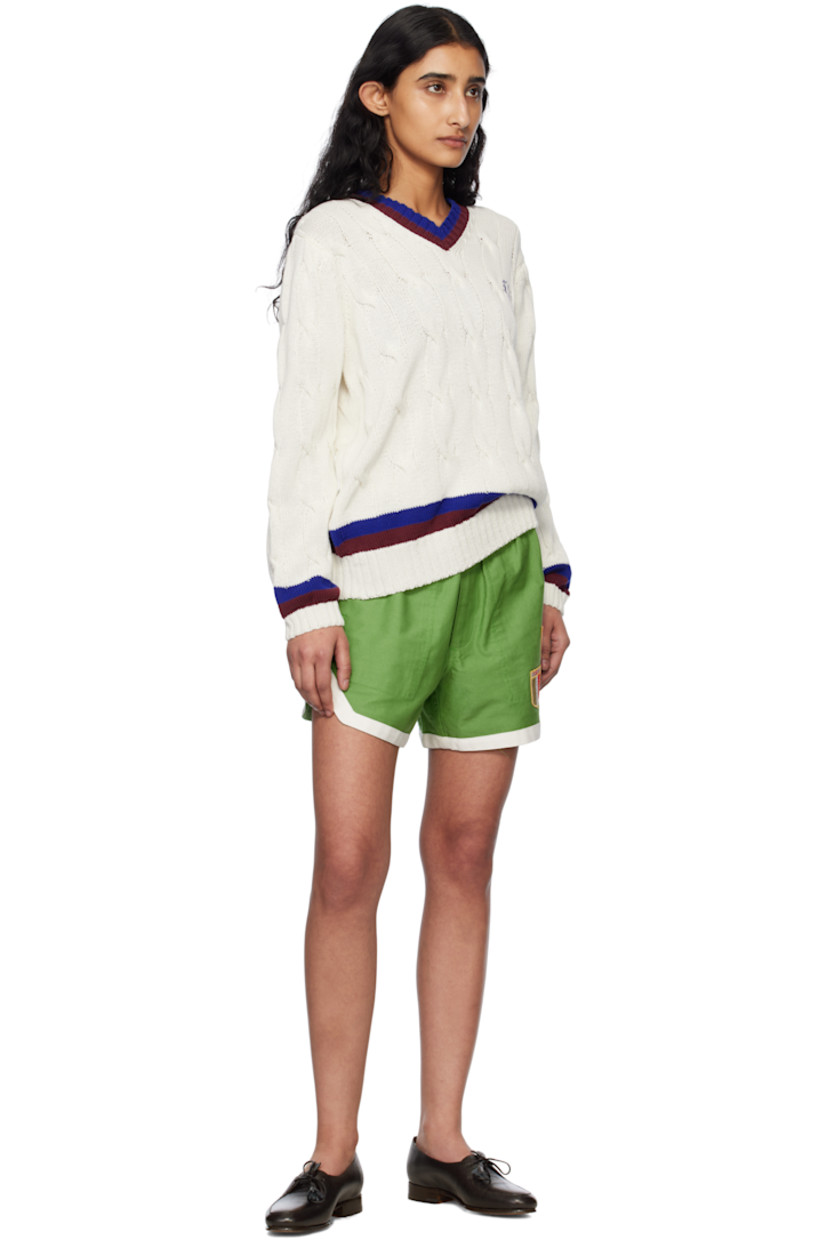 Cable-knit cotton sweater.

· Stripes at rib-knit V-neck, hem, and cuffs
· Logo embroidered at chest
· Dropped shoulders

This item is part of a limited run of 60.

Supplier color: Cream
