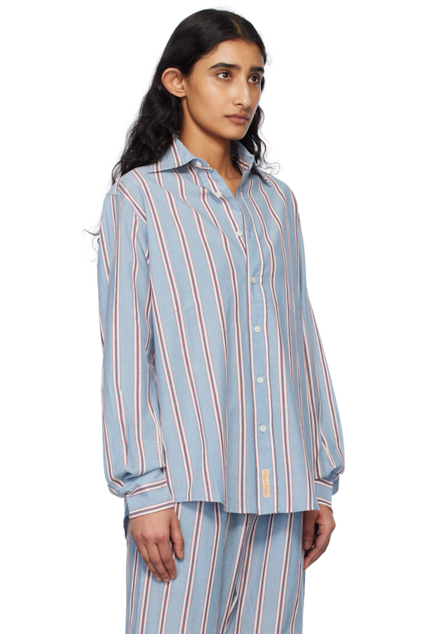 Cotton poplin shirt. Stripes throughout.

· Spread collar
· Button closure
· Shirttail hem
· Pleated single-button barrel cuffs
· Twin pleats at back yoke

This item is part of a limited run of 85.

Supplier color: Blue