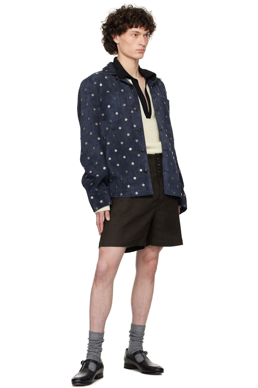 Suede shirt. Graphic hardware throughout. 

· Open spread collar 
· Button closure
· Patch pockets
· Vented side seams
· Full satin lining 
· Silver-tone hardware

This item is part of a limited run of 40.

Supplier color: Dark navy