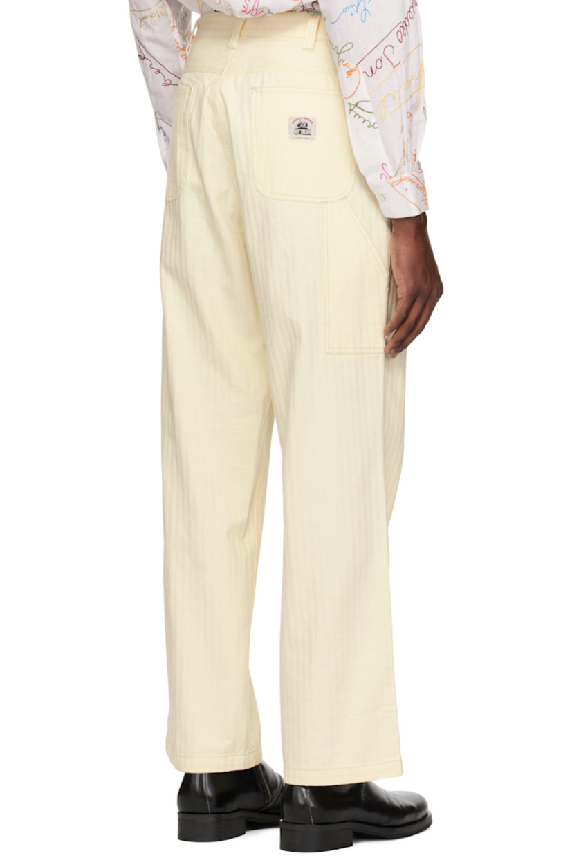 Cotton herringbone trousers.

· Belt loops
· Five-pocket styling
· Zip fly
· Logo patch at coin pocket and back
· Hammer loop at outseam
· Patch pocket at outseam
· Contrast stitching in green

This item is part of a limited run of 95.

Supplier color: Ivory