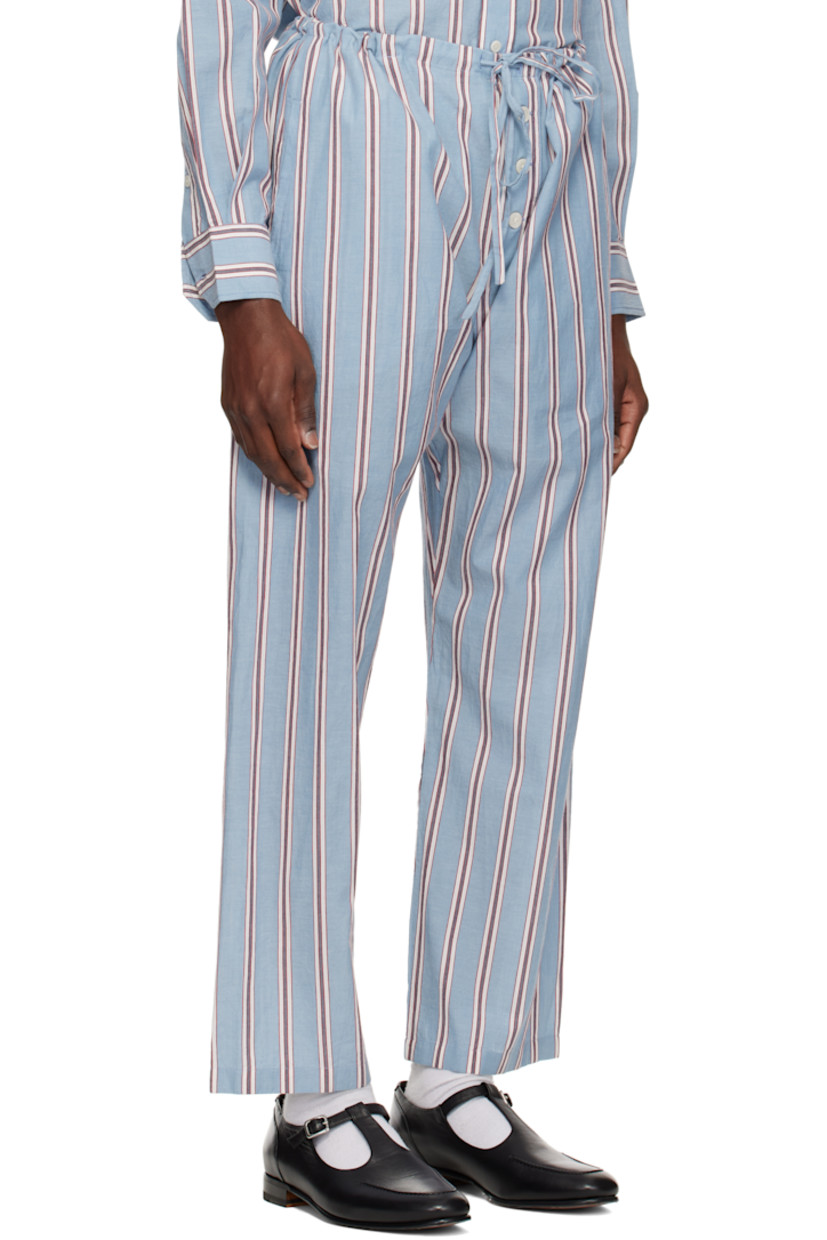 Cotton poplin pyjama pants. Stripes throughout.

· Drawstring at waistband
· Three-pocket styling
· Exposed button fly

This item is part of a limited run of 70.

Supplier color: Blue