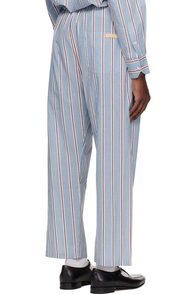 Cotton poplin pyjama pants. Stripes throughout.

· Drawstring at waistband
· Three-pocket styling
· Exposed button fly

This item is part of a limited run of 70.

Supplier color: Blue