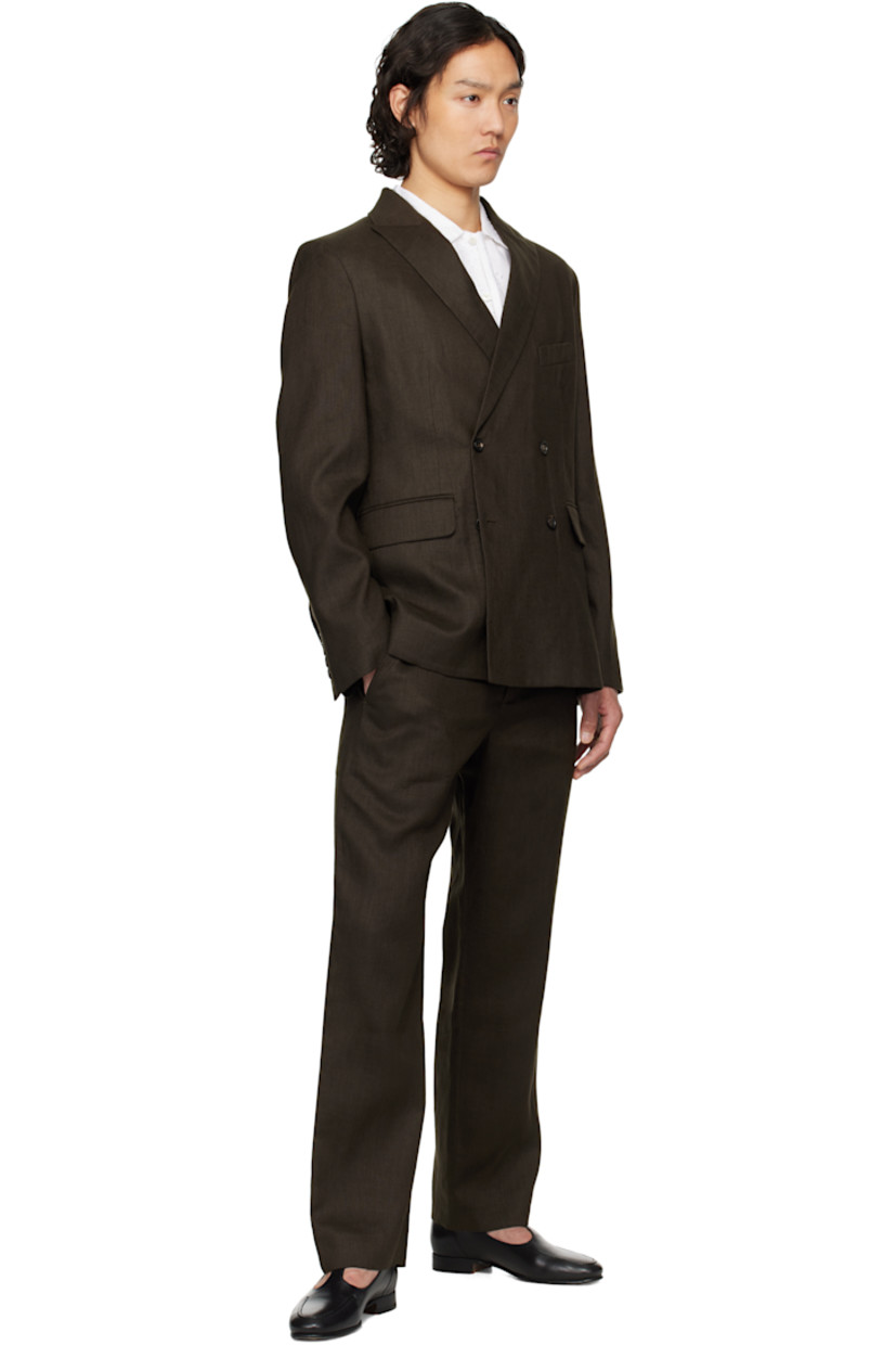 Lightweight plain-woven linen trousers. 

· Cinch tabs at waistband 
· Four-pocket styling 
· Zip fly 
· Darts at back 
· Full satin lining 

This item is part of a limited run of 185.

Supplier color: Brown/Black
