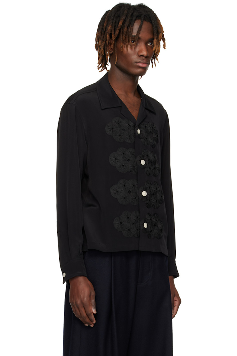 Silk satin shirt.

· Open spread collar
· Button closure
· Gathered ribbon appliqués at front
· Buttoned barrel cuffs

This item is part of a limited run of 71.

Supplier color: Black