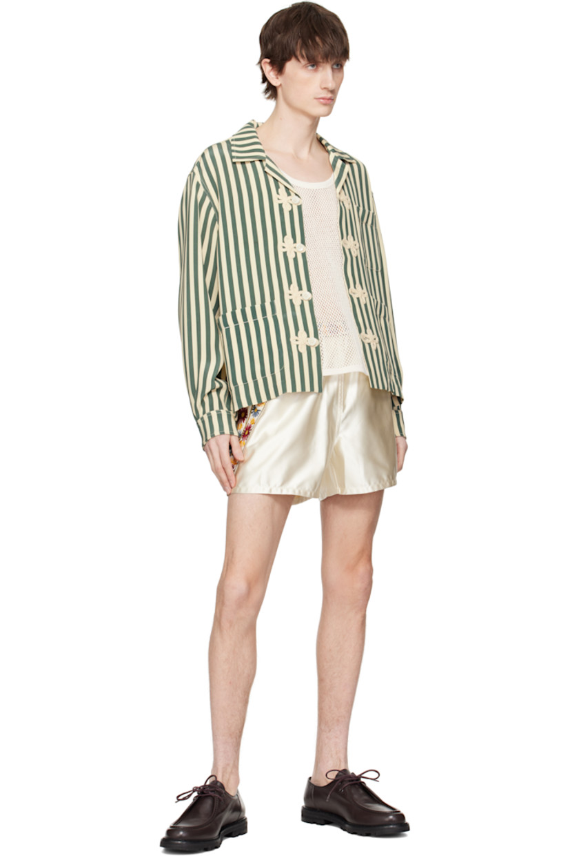Silk satin shirt. Stripes throughout.

· Open spread collar
· Embroidered appliqués at button closure
· Patch pockets
· Buttoned barrel cuffs

This item is part of a limited run of 48.

Supplier color: Green/Cream