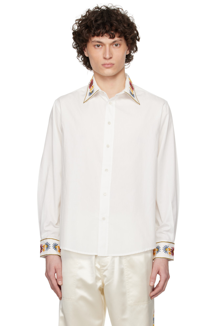 Cotton poplin shirt. 

· Embroidered floral pattern at spread collar and cuffs 
· Button closure 
· Shirttail hem 
· Pleated single-button barrel cuffs 
· Twin pleats at back yoke

This item is part of a limited run of 104.

Supplier color: White