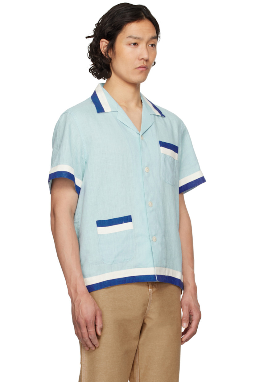 Lightweight plain-woven linen shirt. Striped trim throughout. 

· Open spread collar 
· Button closure 
· Patch pockets at front 

This item is part of a limited run of 235. 

Supplier color: White blue