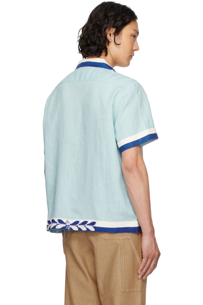 Lightweight plain-woven linen shirt. Striped trim throughout. 

· Open spread collar 
· Button closure 
· Patch pockets at front 

This item is part of a limited run of 235. 

Supplier color: White blue