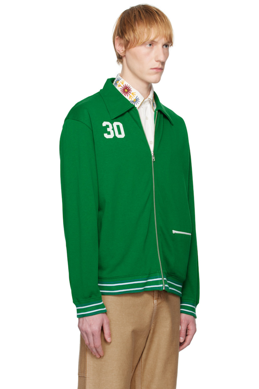 Heavyweight knit cotton- and lyocell-blend jacket. 

· Spread collar
· Zip closure
· Text appliqués at chest
· Zip pocket at front 
· Striped rib-knit hem and cuffs
· Text printed at back 
· Full jersey lining

This item is part of a limited run of 90.

Supplier color: Green