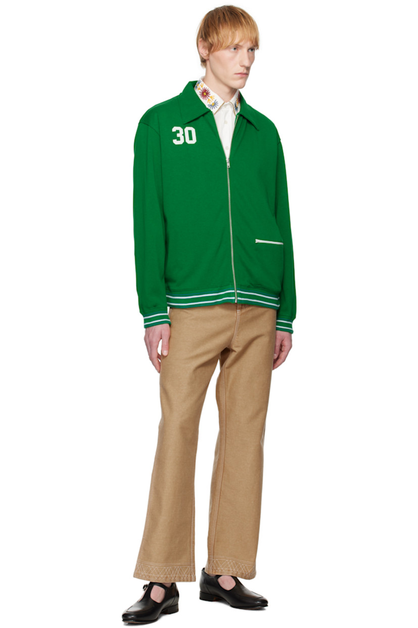Heavyweight knit cotton- and lyocell-blend jacket. 

· Spread collar
· Zip closure
· Text appliqués at chest
· Zip pocket at front 
· Striped rib-knit hem and cuffs
· Text printed at back 
· Full jersey lining

This item is part of a limited run of 90.

Supplier color: Green