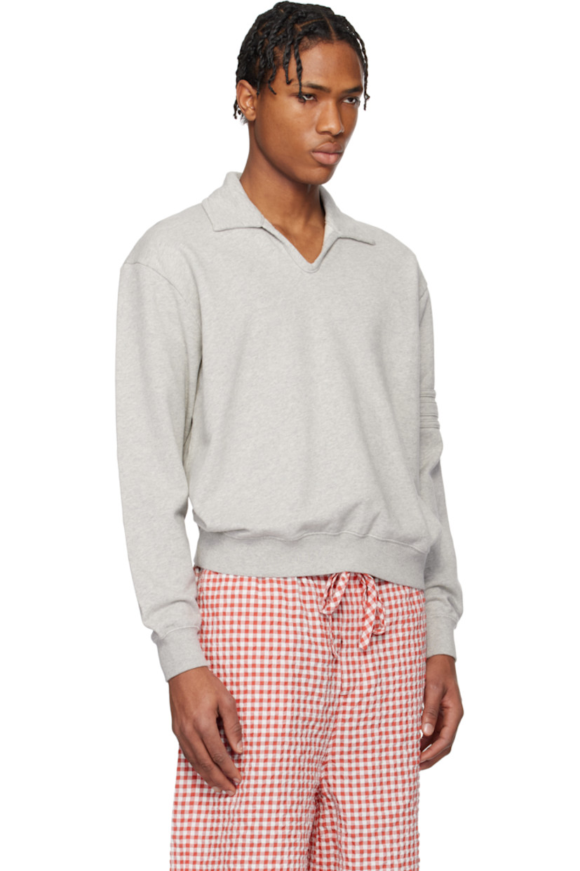 French terry polo.

· Spread collar
· Open placket
· Rib-knit hem and cuffs
· Stripe appliqués at sleeve
· Logo embroidered at back

This item is part of a limited run of 90.

Supplier color: Heathered grey