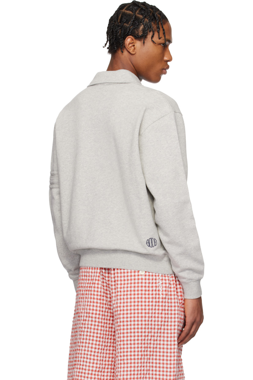 French terry polo.

· Spread collar
· Open placket
· Rib-knit hem and cuffs
· Stripe appliqués at sleeve
· Logo embroidered at back

This item is part of a limited run of 90.

Supplier color: Heathered grey