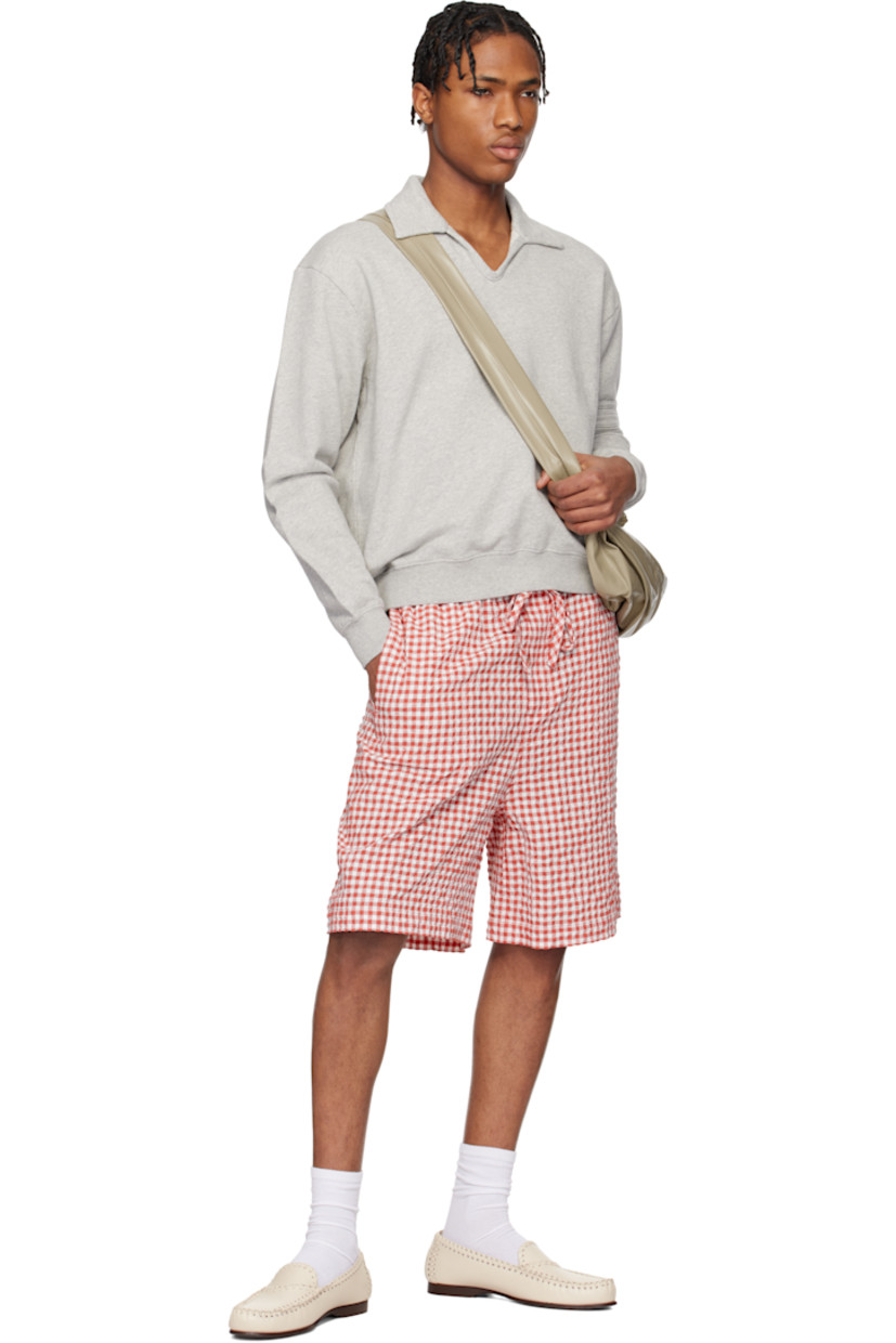 French terry polo.

· Spread collar
· Open placket
· Rib-knit hem and cuffs
· Stripe appliqués at sleeve
· Logo embroidered at back

This item is part of a limited run of 90.

Supplier color: Heathered grey