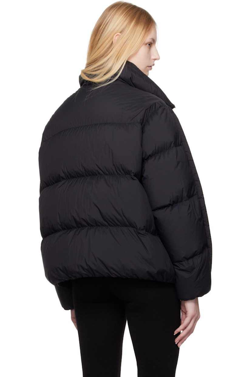 Down-filled and quilted lightweight nylon taffeta jacket.

· DIST-certified down
· Stand collar
· Two-way zip closure
· Zip vents at front
· Seam pockets
· Elasticized hem and cuffs
· Piping at sleeves
· Full longue saison lining

Part of the Moncler Genius x Willow Smith collaboration.

Supplier color: Black

Fill: 90% goose down, 10% goose feather.