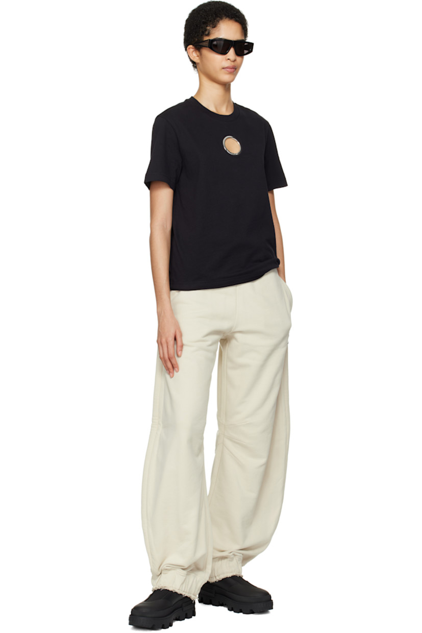 French terry sweatpants.

· Concealed drawstring at elasticized waistband
· Raw edge at waistband and cuffs
· Three-pocket styling
· Embroidered logo patch with O-ring at front
· Darts at inseams
· Elasticized cuffs

Part of the Moncler Genius x Willow Smith collaboration.

Supplier color: Beige
