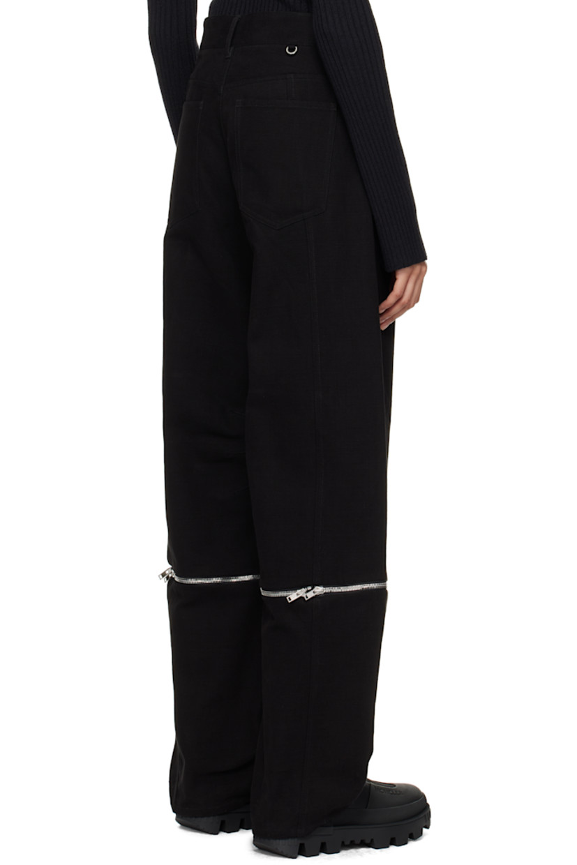 Cotton canvas trousers.

· Belt loops
· Five-pocket styling
· Zip-fly
· Darts at inseam
· Detachable zip panel at legs for alternate styling
· O-ring at back waistband

Part of the Moncler Genius x Willow Smith collaboration.

Supplier color: Black