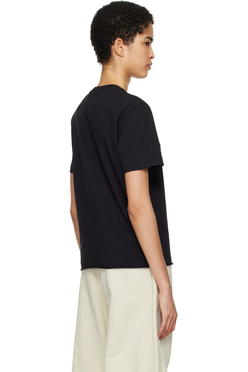 Cotton jersey T-shirt.

· Rib-knit crewneck
· Grommet at chest
· Rolled edge at hem
· Embroidered logo patch with O-ring at sleeve
· Logo-engraved silver-tone hardware

Part of the Moncler Genius x Willow Smith collaboration.

Supplier color: Black