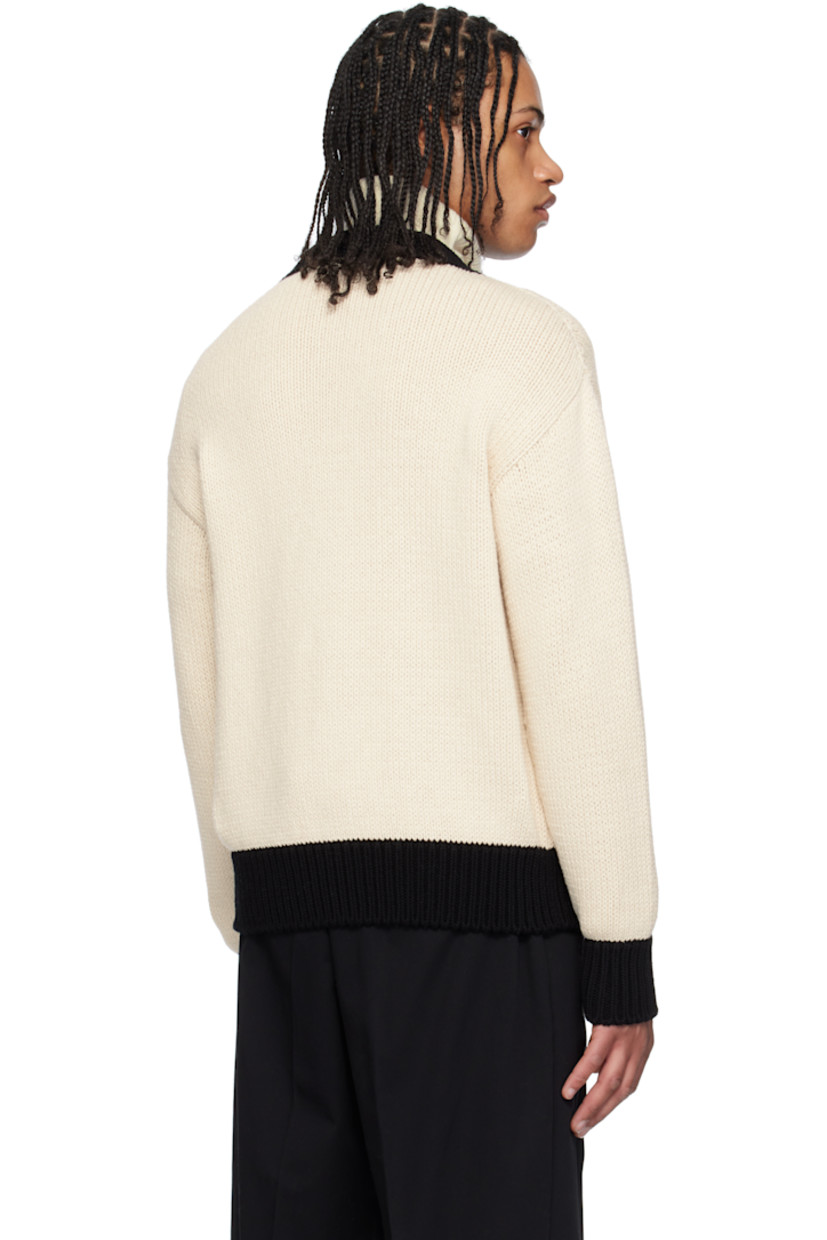 3-gauge stockinette-stitch knit cotton cardigan. 

· Y-neck
· Button closure
· Rib-knit hem and cuffs
· Logo and text embroidered at chest
· Patch pockets
· Felted logo patch at sleeve

Part of the Moncler Genius x FRGMT by Hiroshi Fujiwara collaboration.

Supplier color: White