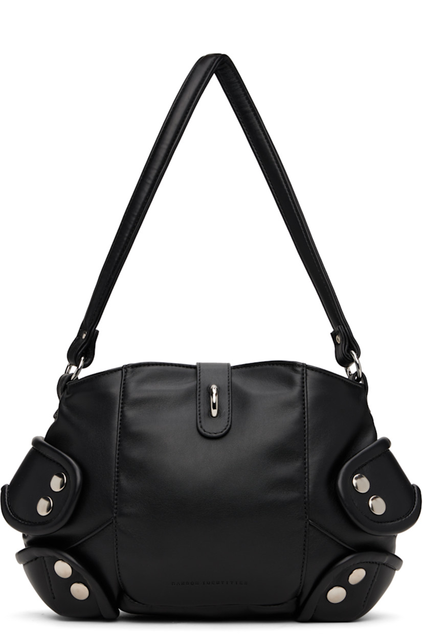 Padded buffed faux-leather messenger bag in black.

· Fixed shoulder strap
· Logo embossed at face
· Studded overlays at sides
· Tab-slot closure
· Patch pocket at interior
· Quilted taffeta lining
· H9" x W11" x D3.5"

Supplier color: Black