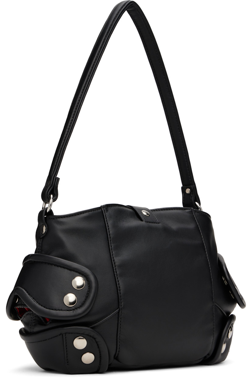 Padded buffed faux-leather messenger bag in black.

· Fixed shoulder strap
· Logo embossed at face
· Studded overlays at sides
· Tab-slot closure
· Patch pocket at interior
· Quilted taffeta lining
· H9" x W11" x D3.5"

Supplier color: Black