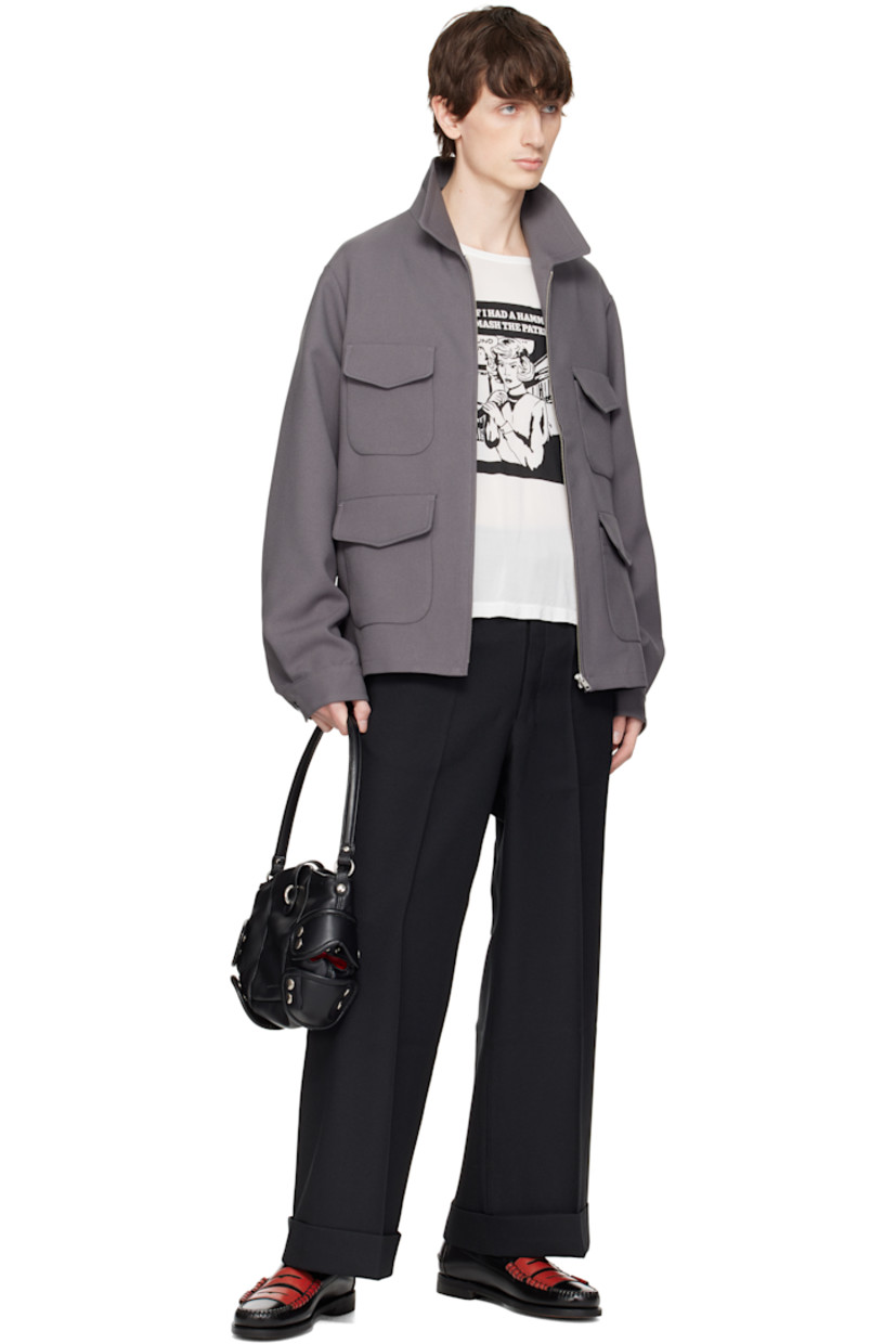 Padded buffed faux-leather messenger bag in black.

· Fixed shoulder strap
· Logo embossed at face
· Studded overlays at sides
· Tab-slot closure
· Patch pocket at interior
· Quilted taffeta lining
· H9" x W11" x D3.5"

Supplier color: Black