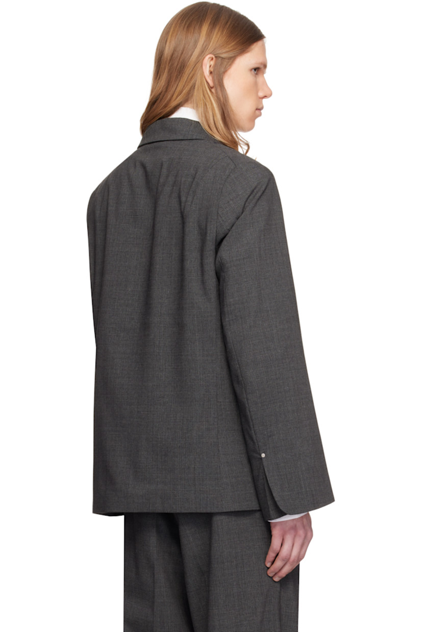 Stretch wool-blend flannel blazer. Houndstooth pattern throughout.

· Peaked lapel
· Double-breasted button closure
· Patch pocket at chest
· Welt pockets at front
· Padded shoulders
· Vented cuffs
· Darts at back shoulders
· Welt pockets at interior
· Full satin lining

Supplier color: Dark grey