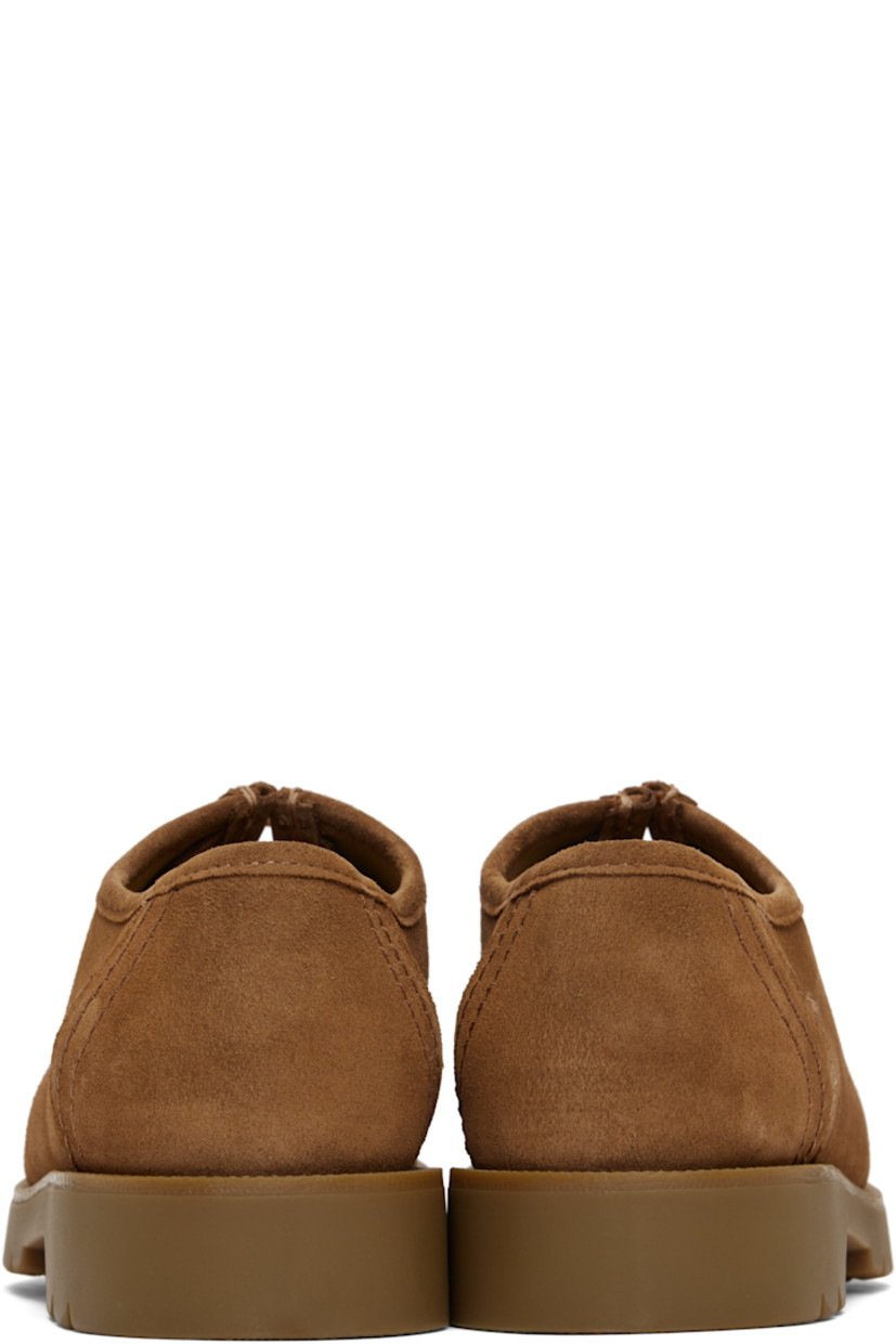 LWG-certified suede derbys in tan.

· Scalloped edge at moc toe
· Lace-up closure
· Grained leather and microfiber lining
· Serrated detailing at welt
· Treaded rubber sole

Supplier color: Cognac