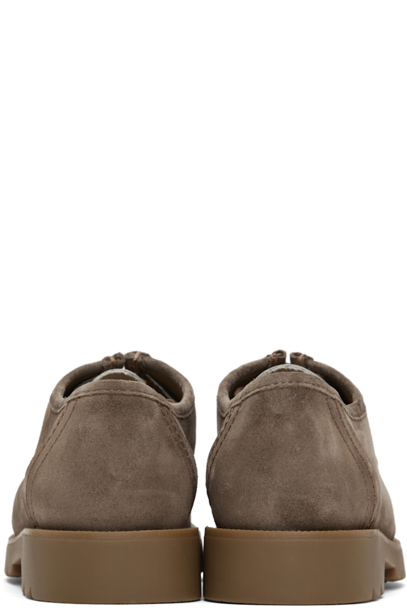 LWG-certified suede and hair-on leather derbys in taupe.

· Scalloped edge at moc toe
· Snake pattern at vamp
· Lace-up closure
· Grained leather and microfiber lining
· Serrated detailing at welt
· Treaded rubber sole

Supplier color: Taupe