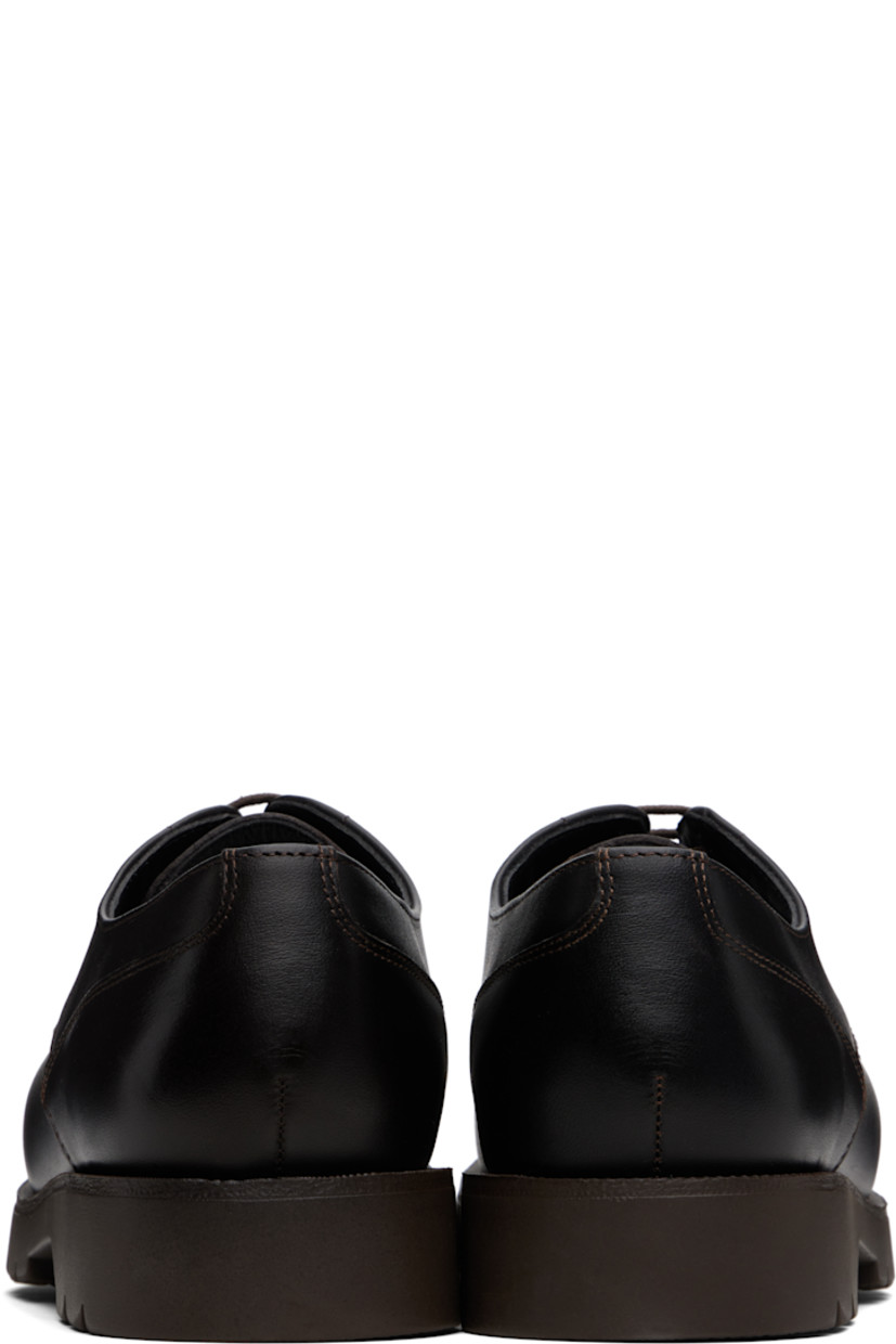 Buffed leather derbys in brown.

· LWG-certified leather
· Moc toe
· Lace-up closure
· Buffed leather and faux-suede lining
· Lugged rubber sole

Supplier color: Brown