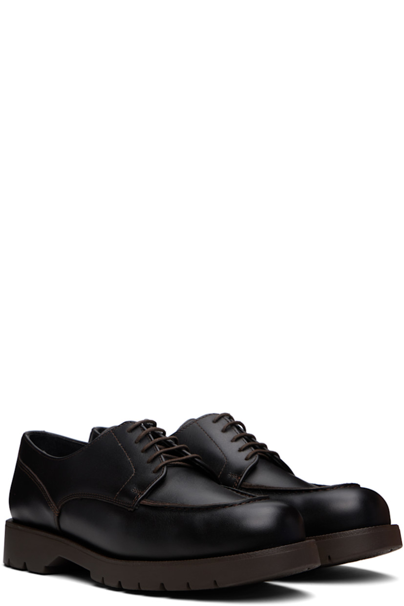 Buffed leather derbys in brown.

· LWG-certified leather
· Moc toe
· Lace-up closure
· Buffed leather and faux-suede lining
· Lugged rubber sole

Supplier color: Brown