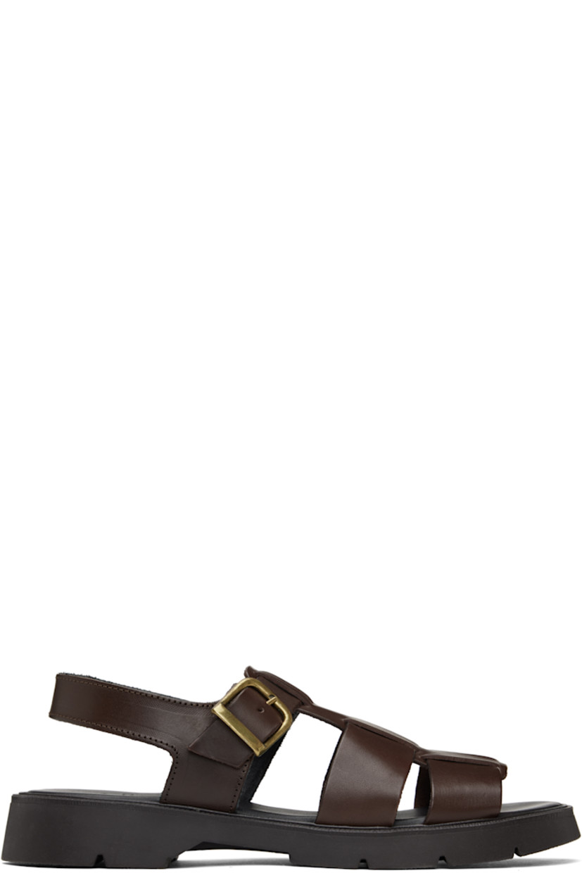 Vegetable-tanned buffed leather sandals in brown.

· LWG-certified and chrome-free leather
· Open toe
· Partially-elasticized pin-buckle ankle strap
· Slingback strap
· Logo embossed at padded footbed
· Grained leather and suede lining
· Serrated detailing at welt
· Treaded rubber sole
· Antiqued brass-tone hardware

Supplier color: Brown