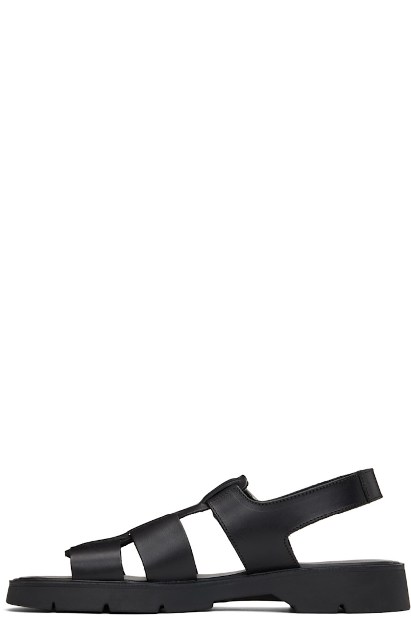 Vegetable-tanned buffed leather sandals in black.

· LWG-certified and chrome-free leather
· Open toe
· Partially-elasticized pin-buckle ankle strap
· Slingback strap
· Logo embossed at padded footbed
· Grained leather and suede lining
· Serrated detailing at welt
· Treaded rubber sole
· Silver-tone hardware

Supplier color: Black
