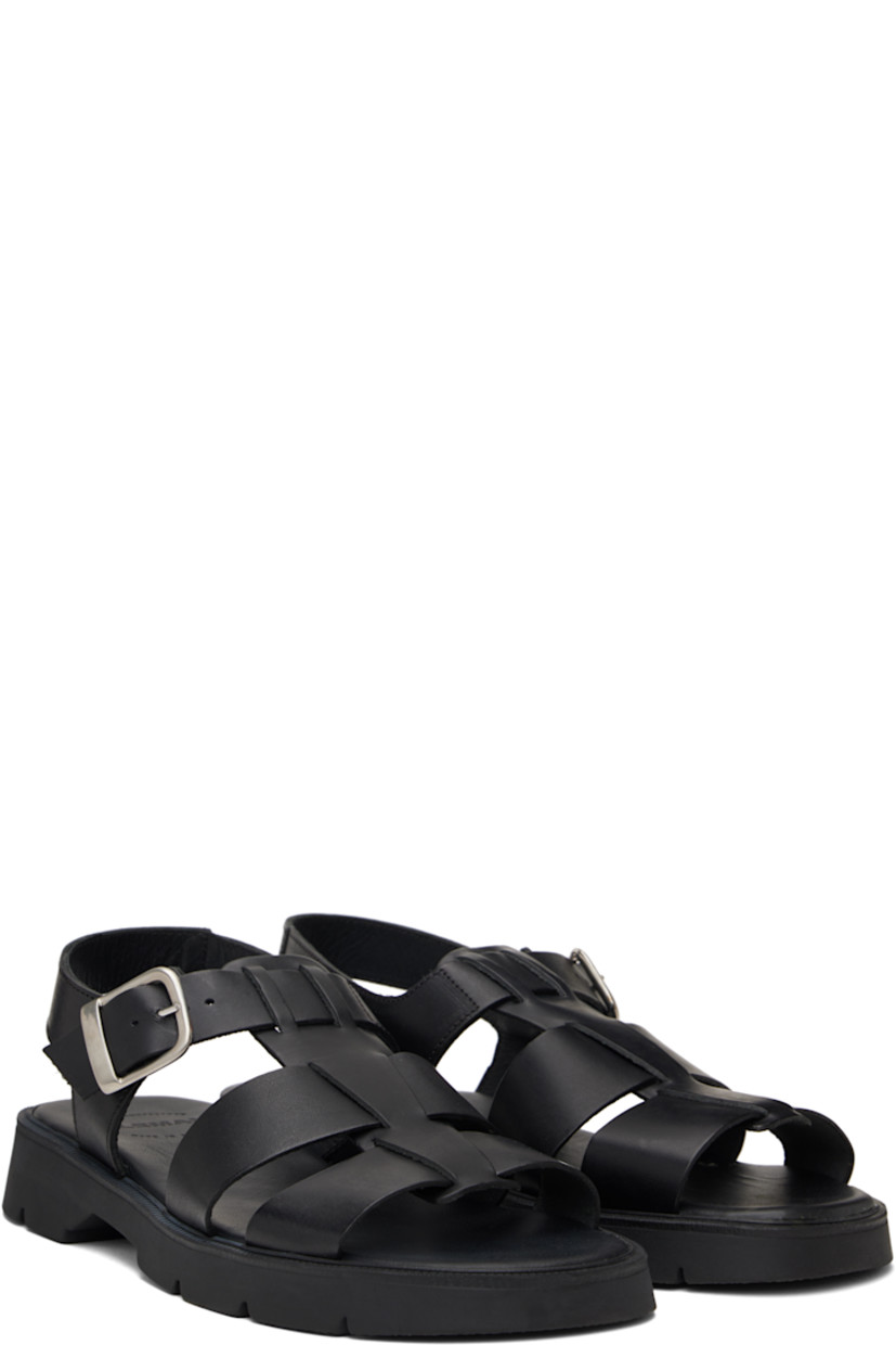Vegetable-tanned buffed leather sandals in black.

· LWG-certified and chrome-free leather
· Open toe
· Partially-elasticized pin-buckle ankle strap
· Slingback strap
· Logo embossed at padded footbed
· Grained leather and suede lining
· Serrated detailing at welt
· Treaded rubber sole
· Silver-tone hardware

Supplier color: Black