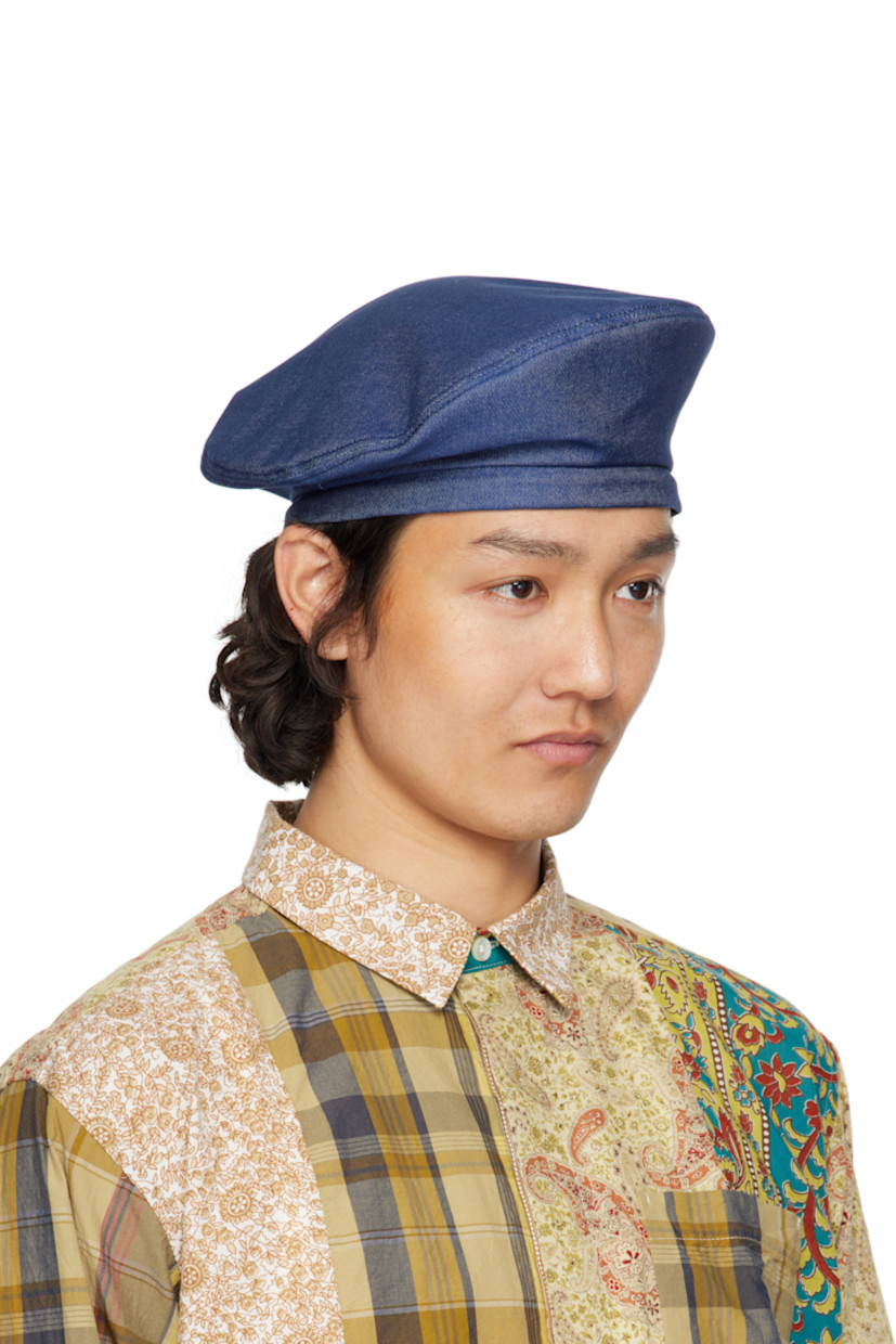 Non-stretch denim beret in blue.

· Drawstring at back face
· Twill lining

Supplier color: Indigo