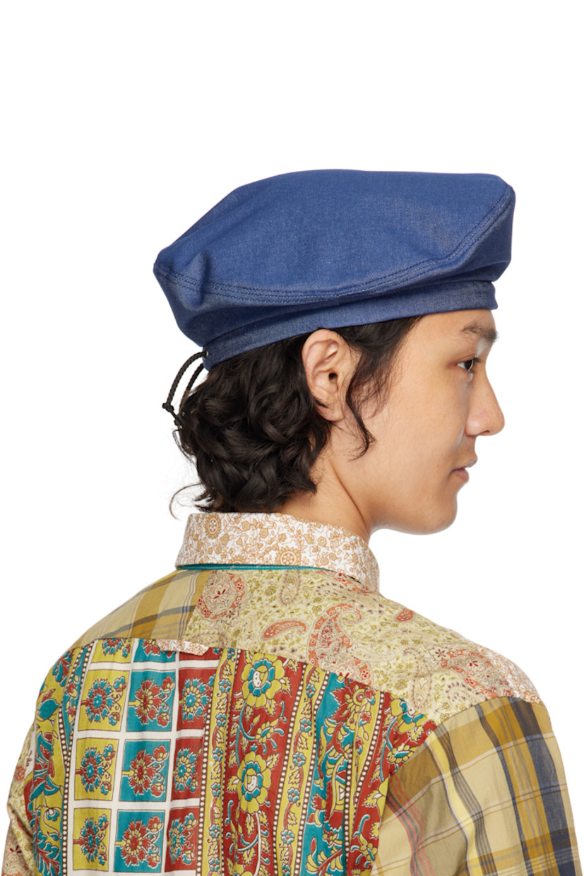 Non-stretch denim beret in blue.

· Drawstring at back face
· Twill lining

Supplier color: Indigo