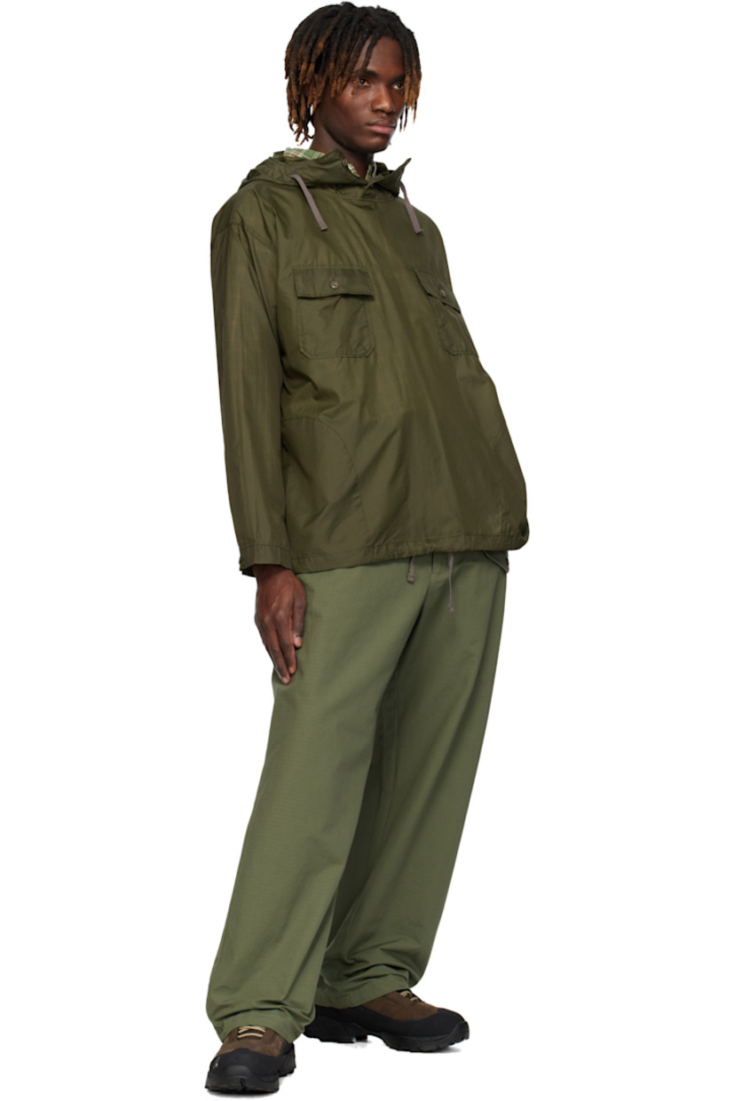 Cotton ripstop trousers.

· Belt loops
· Concealed drawstring at waistband
· Four-pocket styling
· Zip-fly
· Flap pocket at front
· Drawstring at cuffs

Supplier color: Olive cotton ripstop