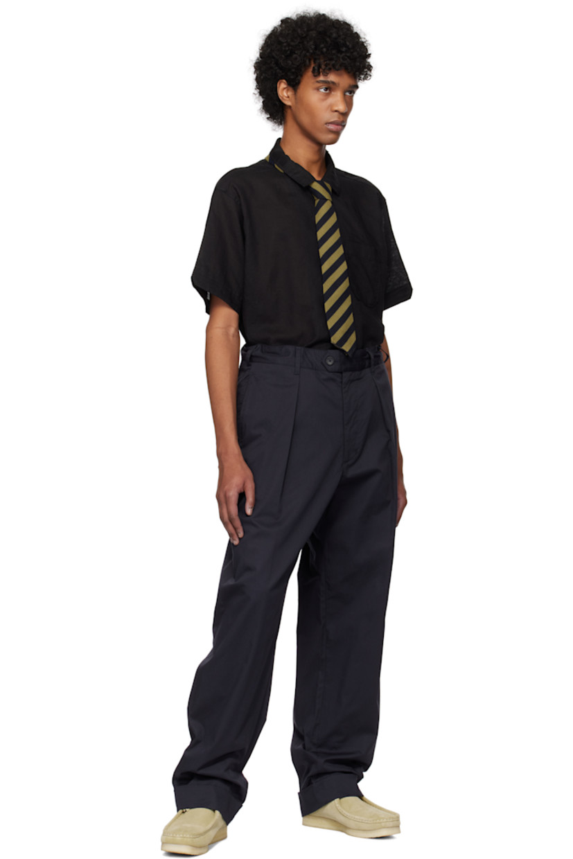 Cotton twill trousers.

· Belt loops
· Concealed drawstring at waistband
· Four-pocket styling
· Zip fly
· Pleats at front
· Rolled cuffs

Supplier color: Dk. navy