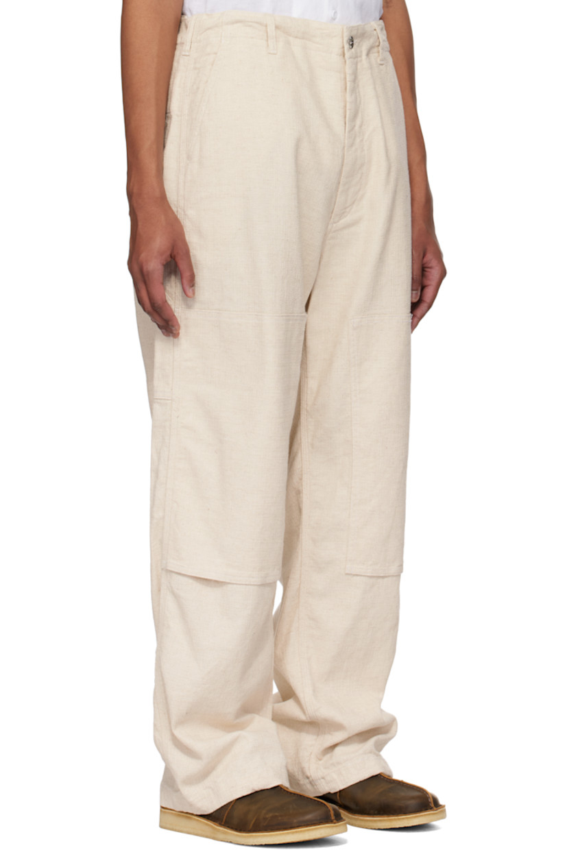 Cotton- and linen-blend Java canvas trousers.

· Belt loops
· Concealed drawstring at waistband and cuffs
· Four-pocket styling
· Zip fly
· Reinforced panel at knees
· Patch pocket at outseam
· Hammer loop at outseam
· Loops and logo patch at back pocket

Supplier color: Natural