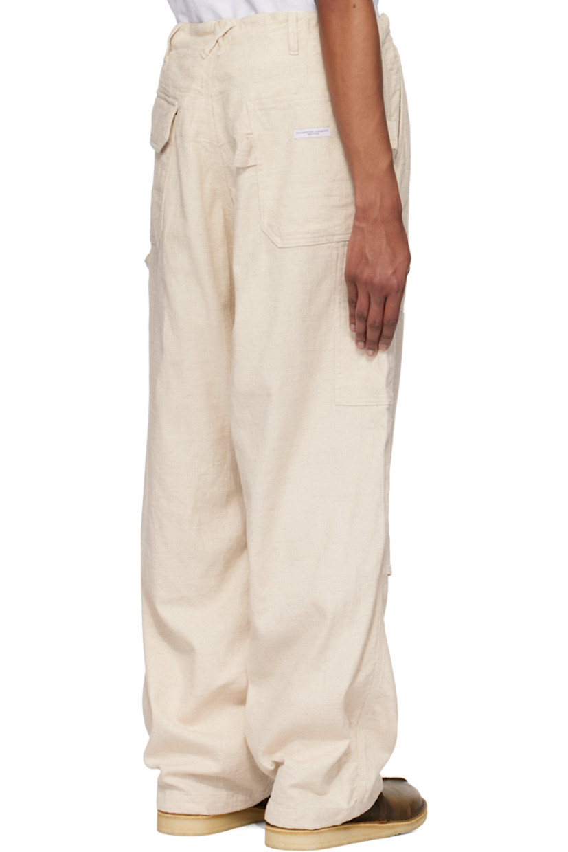 Cotton- and linen-blend Java canvas trousers.

· Belt loops
· Concealed drawstring at waistband and cuffs
· Four-pocket styling
· Zip fly
· Reinforced panel at knees
· Patch pocket at outseam
· Hammer loop at outseam
· Loops and logo patch at back pocket

Supplier color: Natural