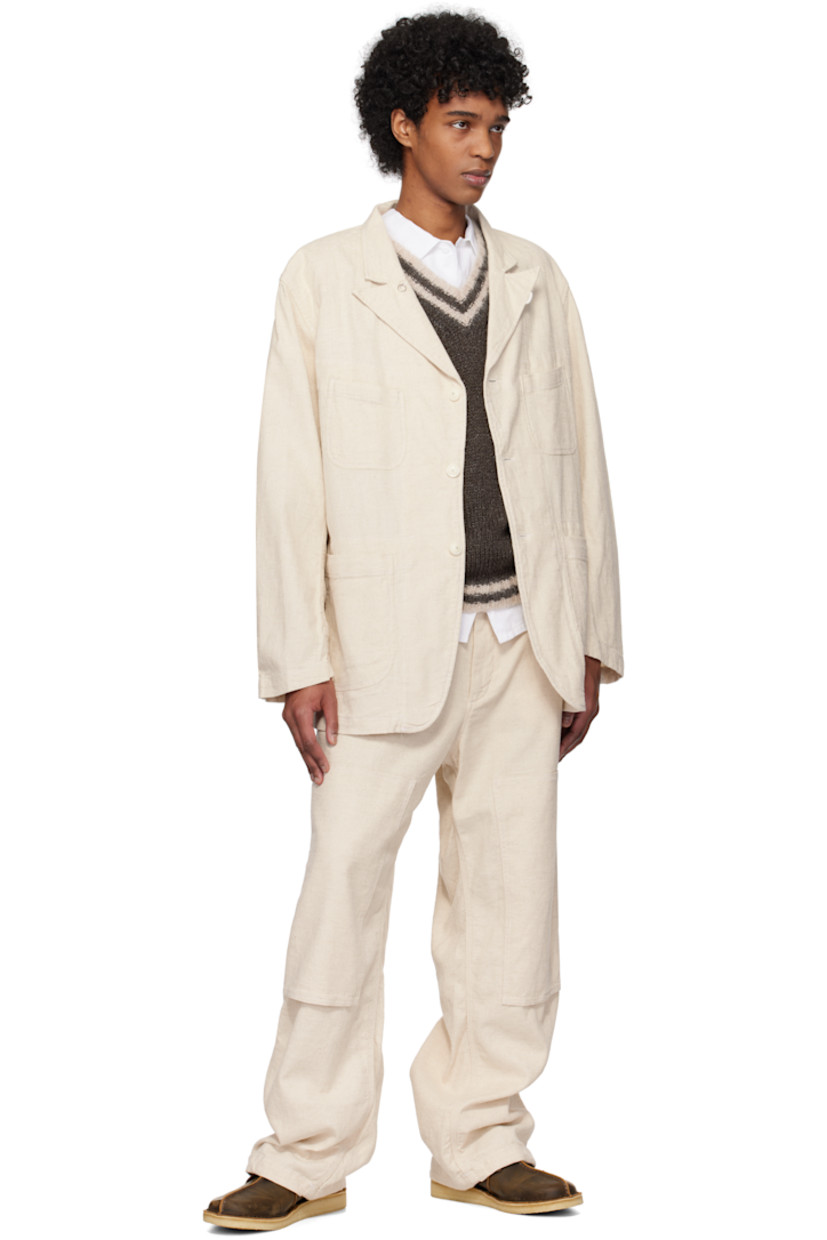 Cotton- and linen-blend Java canvas trousers.

· Belt loops
· Concealed drawstring at waistband and cuffs
· Four-pocket styling
· Zip fly
· Reinforced panel at knees
· Patch pocket at outseam
· Hammer loop at outseam
· Loops and logo patch at back pocket

Supplier color: Natural