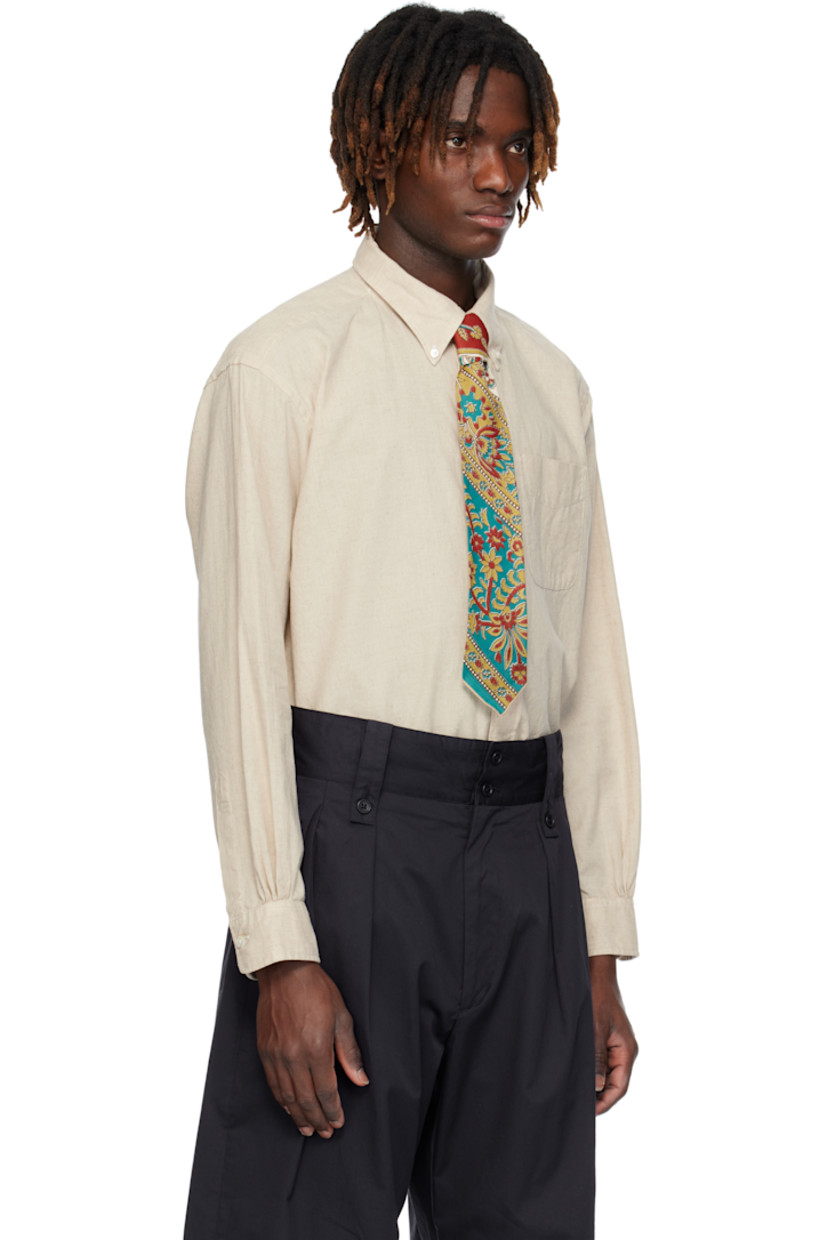 Plain-woven linen- and cotton-blend shirt. 

· Button-down spread collar
· Button closure 
· Patch pocket at chest 
· Shirttail hem 
· Single-button barrel cuffs 
· Box pleat at back yoke 
· Mother-of-pearl hardware

Supplier color: Natural