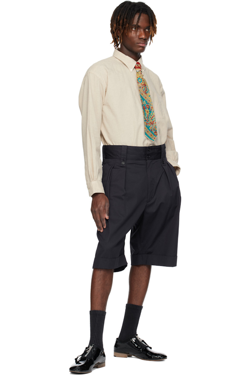 Plain-woven linen- and cotton-blend shirt. 

· Button-down spread collar
· Button closure 
· Patch pocket at chest 
· Shirttail hem 
· Single-button barrel cuffs 
· Box pleat at back yoke 
· Mother-of-pearl hardware

Supplier color: Natural