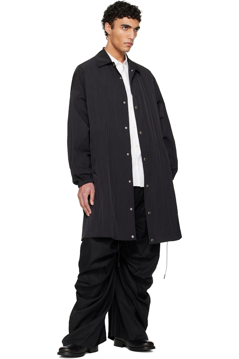 Crinkled nylon taffeta coat.

· Spread collar
· Press-stud closure
· Welt pockets
· Drawstring at hem
· Dropped shoulders
· Dolman sleeves
· Elasticized cuffs
· Zip pocket at interior
· Full ripstop lining

Supplier color: Black