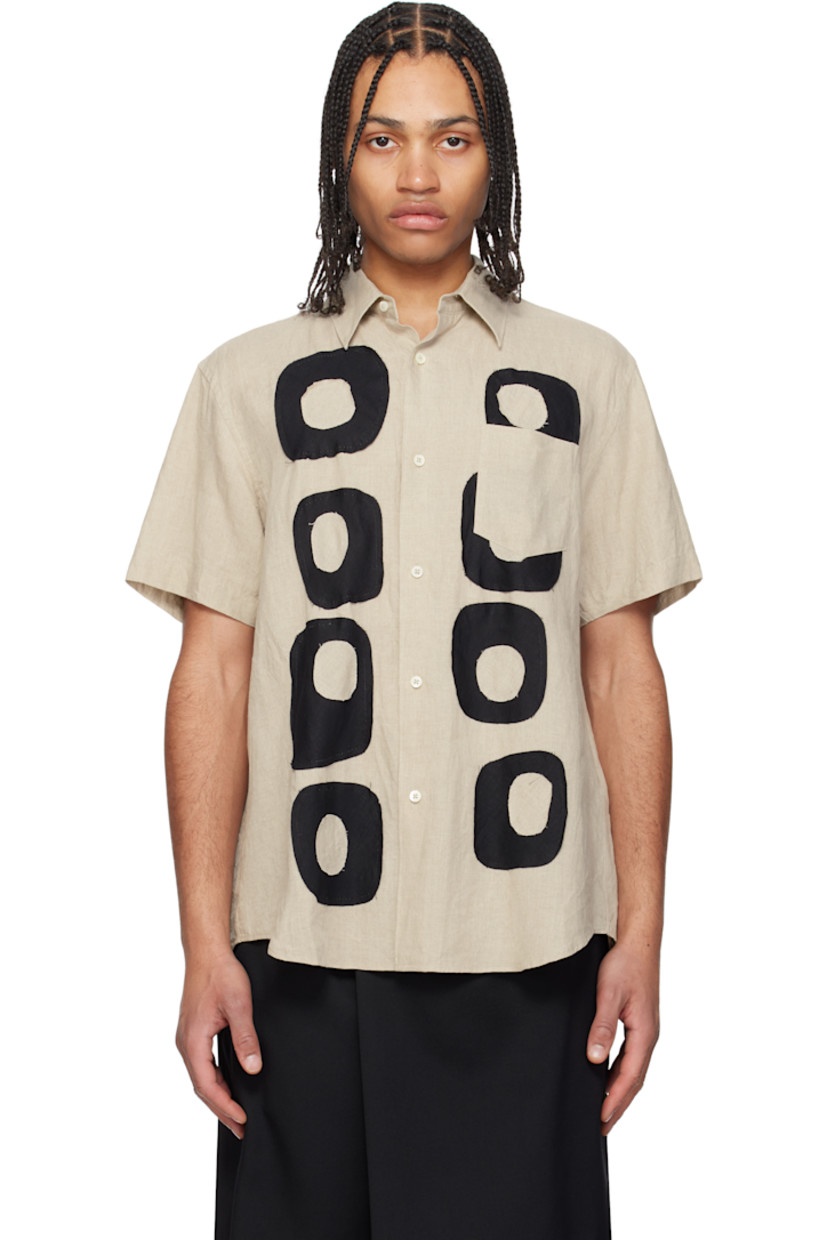 Plain-woven linen shirt. 

· Spread collar
· Button closure
· Plain-woven linen patches at front
· Patch pocket at chest
· Shirttail hem
· Dropped shoulders
· Gathering at back yoke
· Logo-engraved mother-of-pearl hardware

Supplier color: Ecru/Black