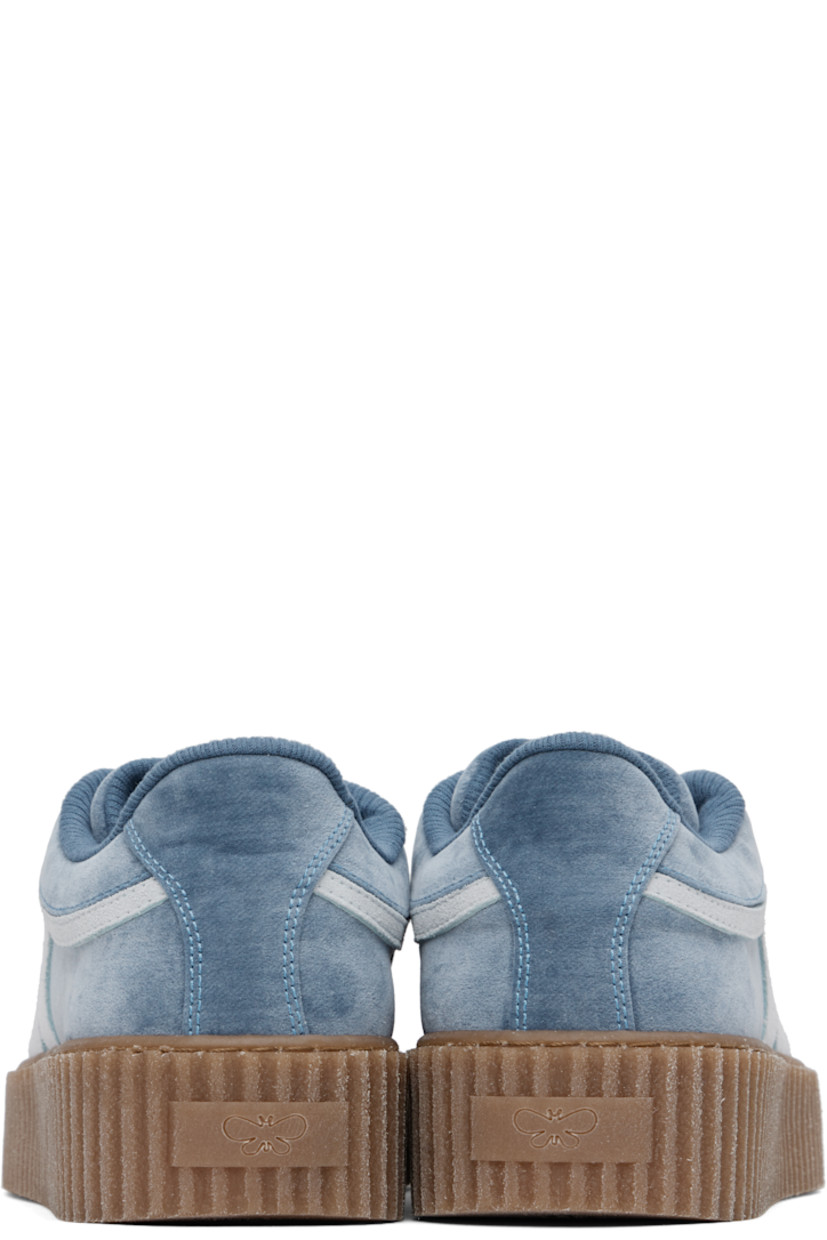 Low-top velvet sneakers in blue.

· Lace-up closure
· Rubberized logo patch at padded tongue
· Padded collar
· Suede logo appliqué at sides
· Jersey lining
· Logo embossed at textured rubber platform midsole
· Treaded rubber sole
· Platform: H1.5"

Supplier color: Light blue