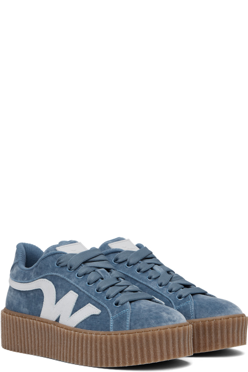 Low-top velvet sneakers in blue.

· Lace-up closure
· Rubberized logo patch at padded tongue
· Padded collar
· Suede logo appliqué at sides
· Jersey lining
· Logo embossed at textured rubber platform midsole
· Treaded rubber sole
· Platform: H1.5"

Supplier color: Light blue