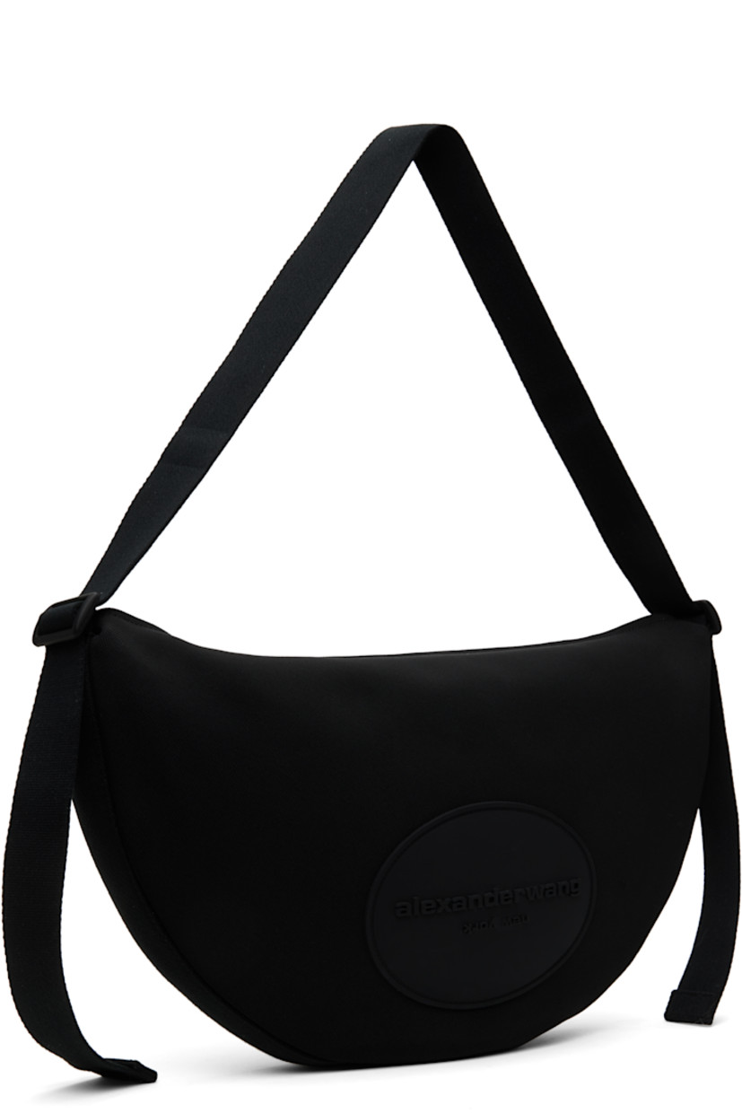 Nylon canvas messenger bag in black. 

· Adjustable webbing crossbody strap
· Rubberized logo patch at face
· Zip closure
· Zip pocket at interior 
· Full twill lining
· H11" x W18.5" x D2"

Supplier color: Black