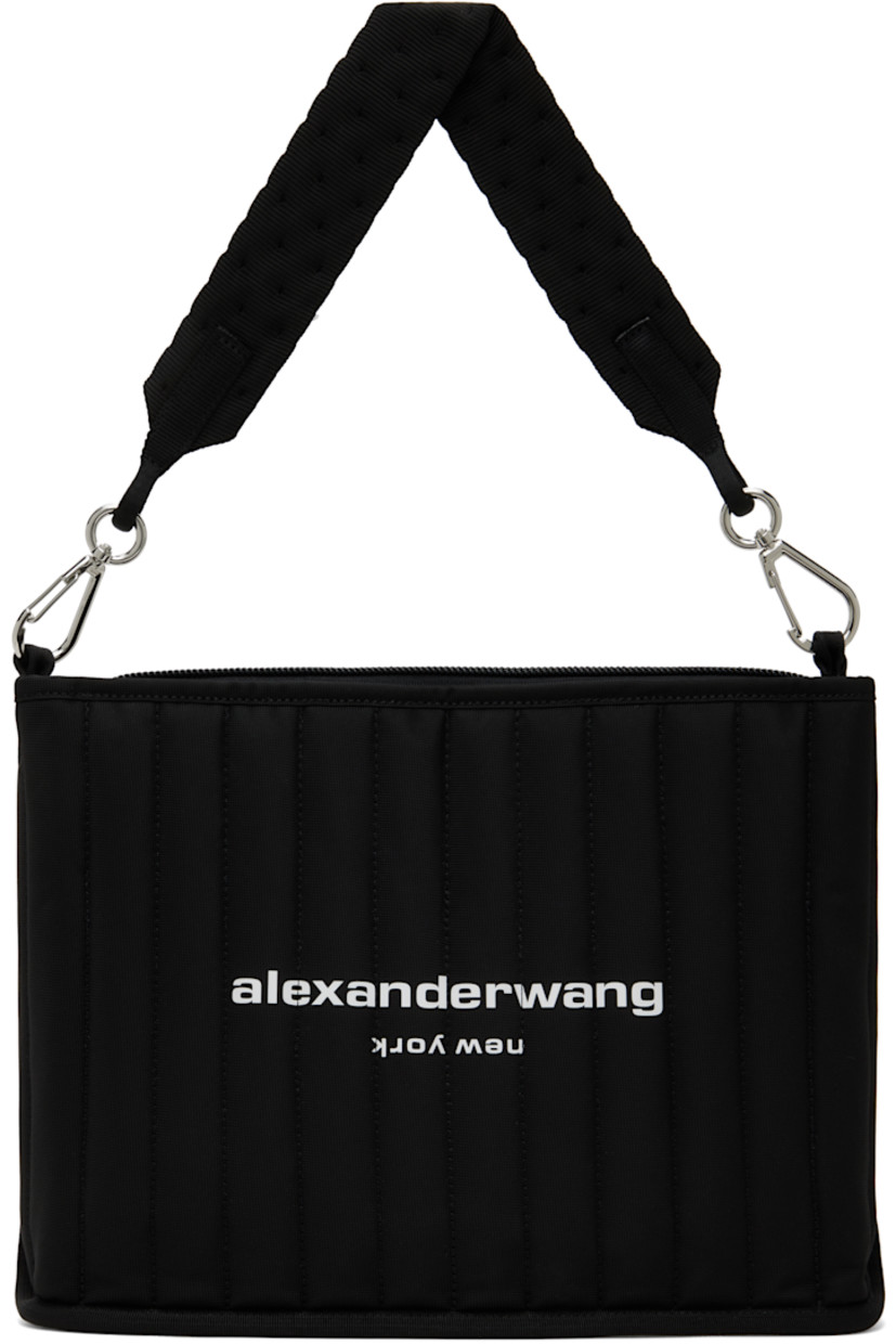 Padded and quilted nylon canvas shoulder bag in black. 

· Detachable shoulder strap
· Logo bonded at face
· Zip closure
· Patch pockets at interior 
· Silver-tone hardware
· H10" x W13.5" x D2.5"

Supplier color: Black